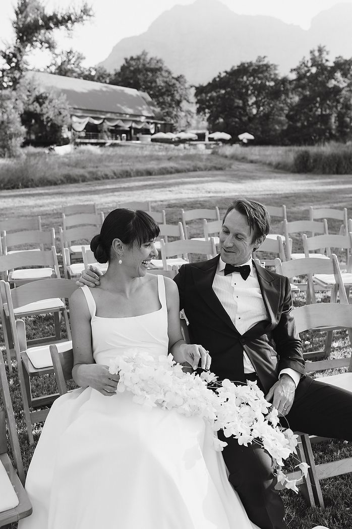 Bride and groom in ceremony area after the ceremony is done.