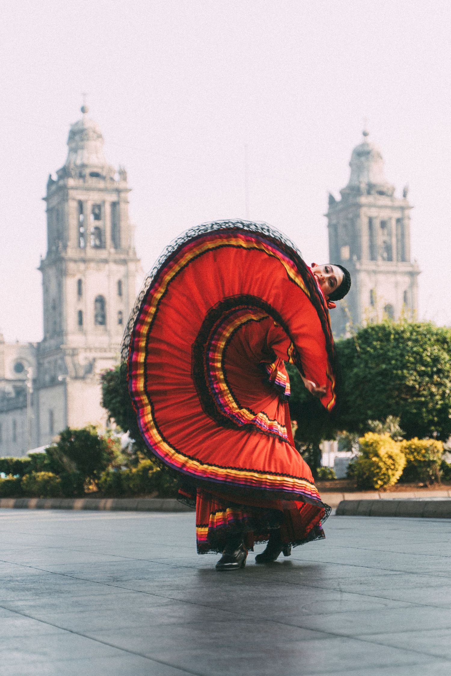 Professional dance photoshoot with Ballet Folklórico de México dancer in front of Mexico City Metropolitan Cathedral plaza
