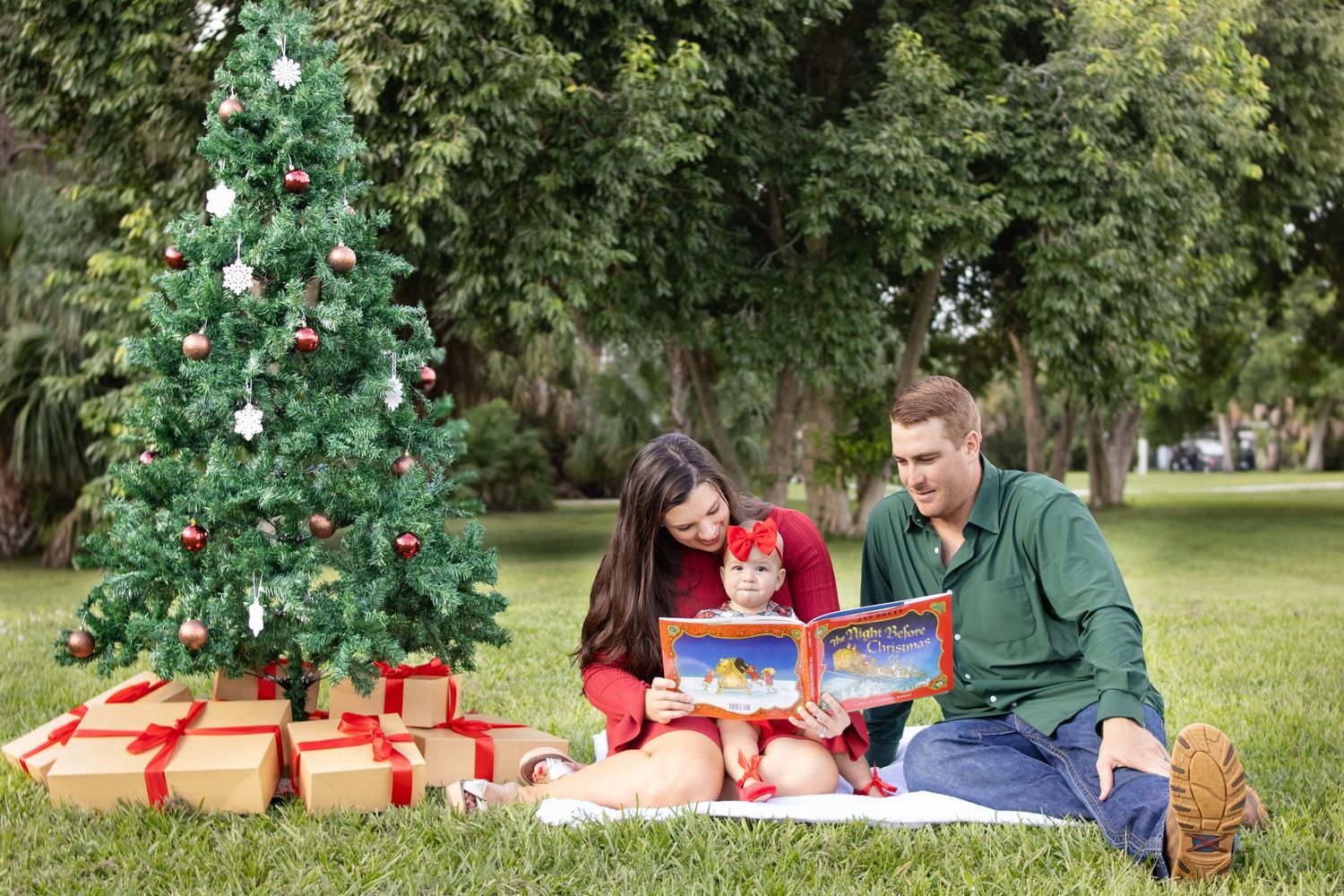 family reading a book christmas photo