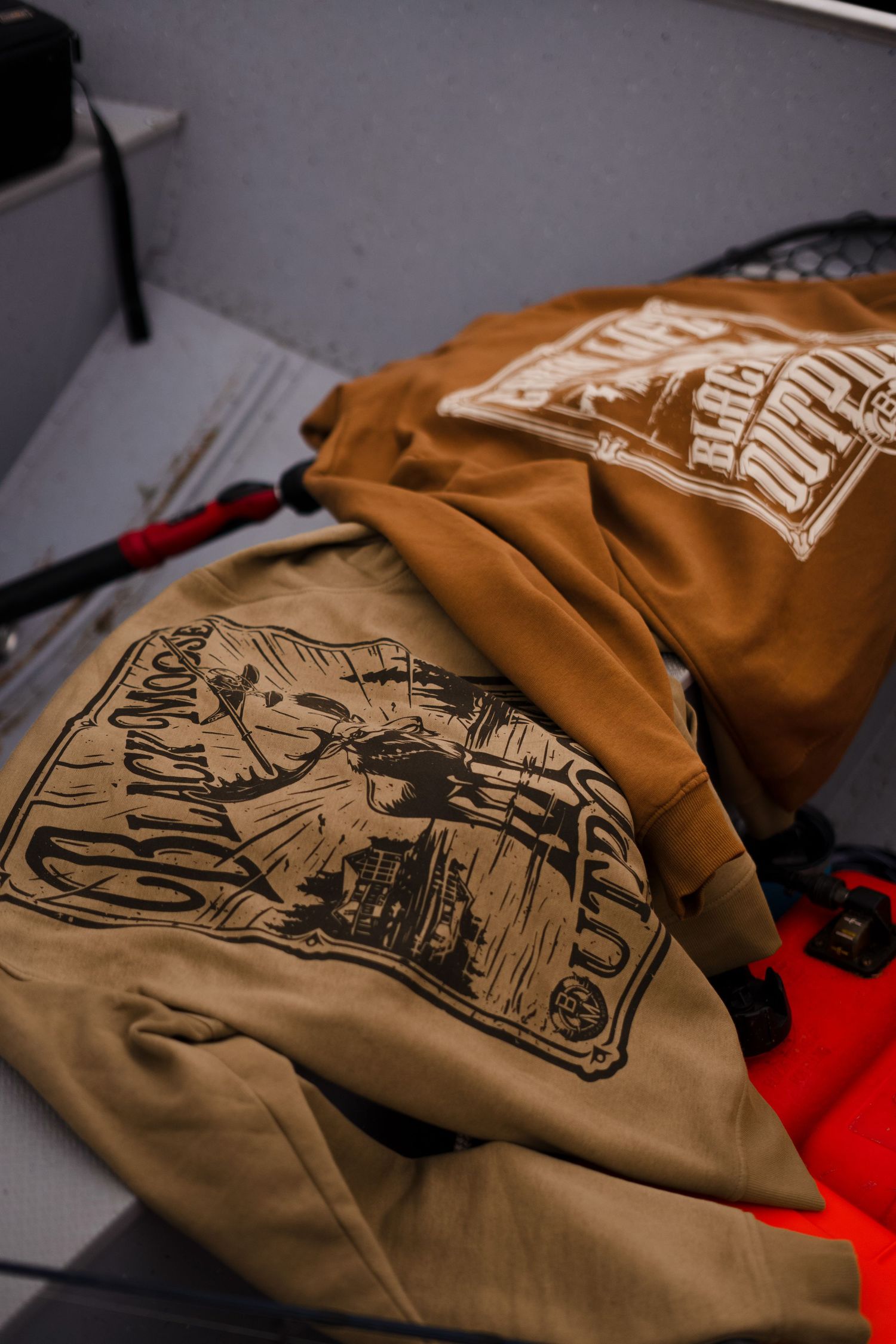 Brown t-shirt with vintage outdoor adventure graphic design.