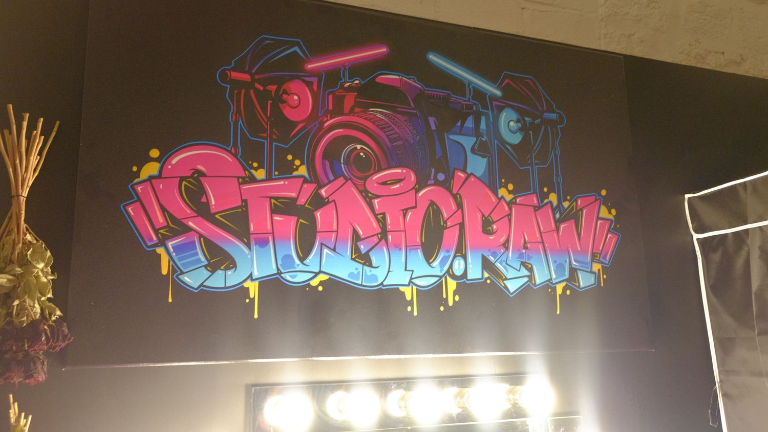 Colorful graffiti art murals with bright text designs painted on dark walls.