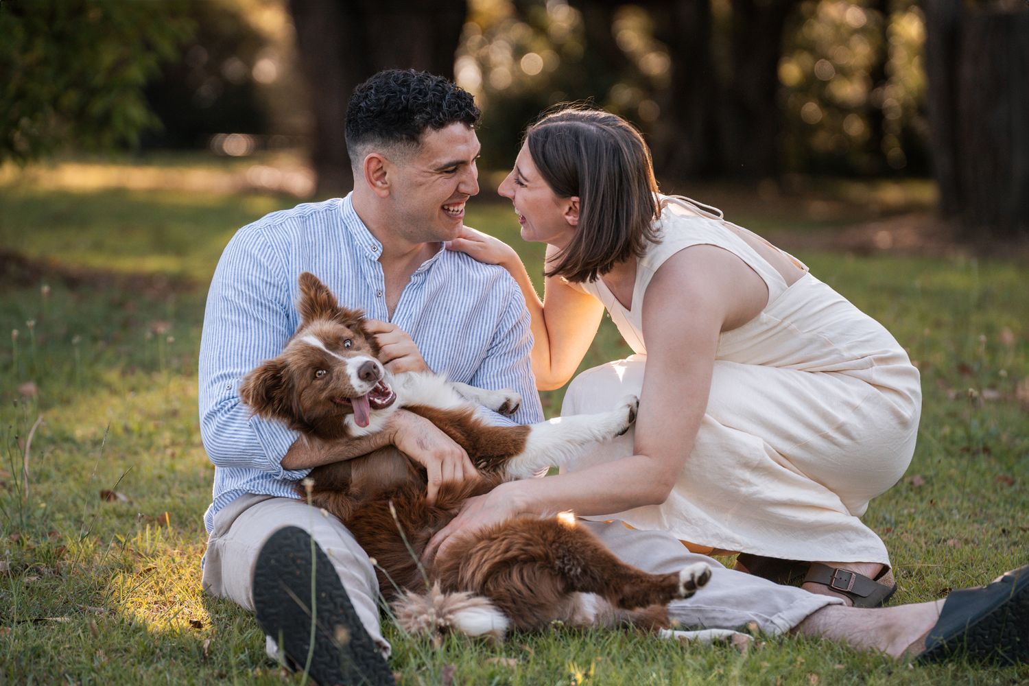 happy-dog-cuddeling-during-a-couple-proposal-photoshoot-in-sydney