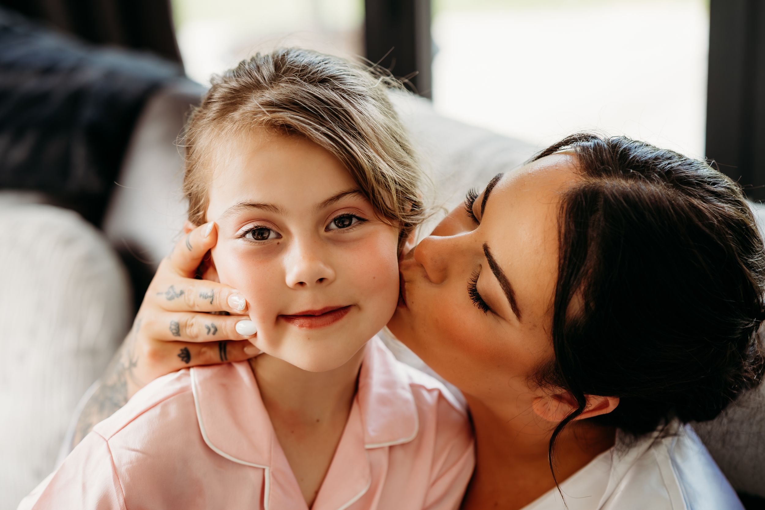 An intimate moment between parent and child showing affection.