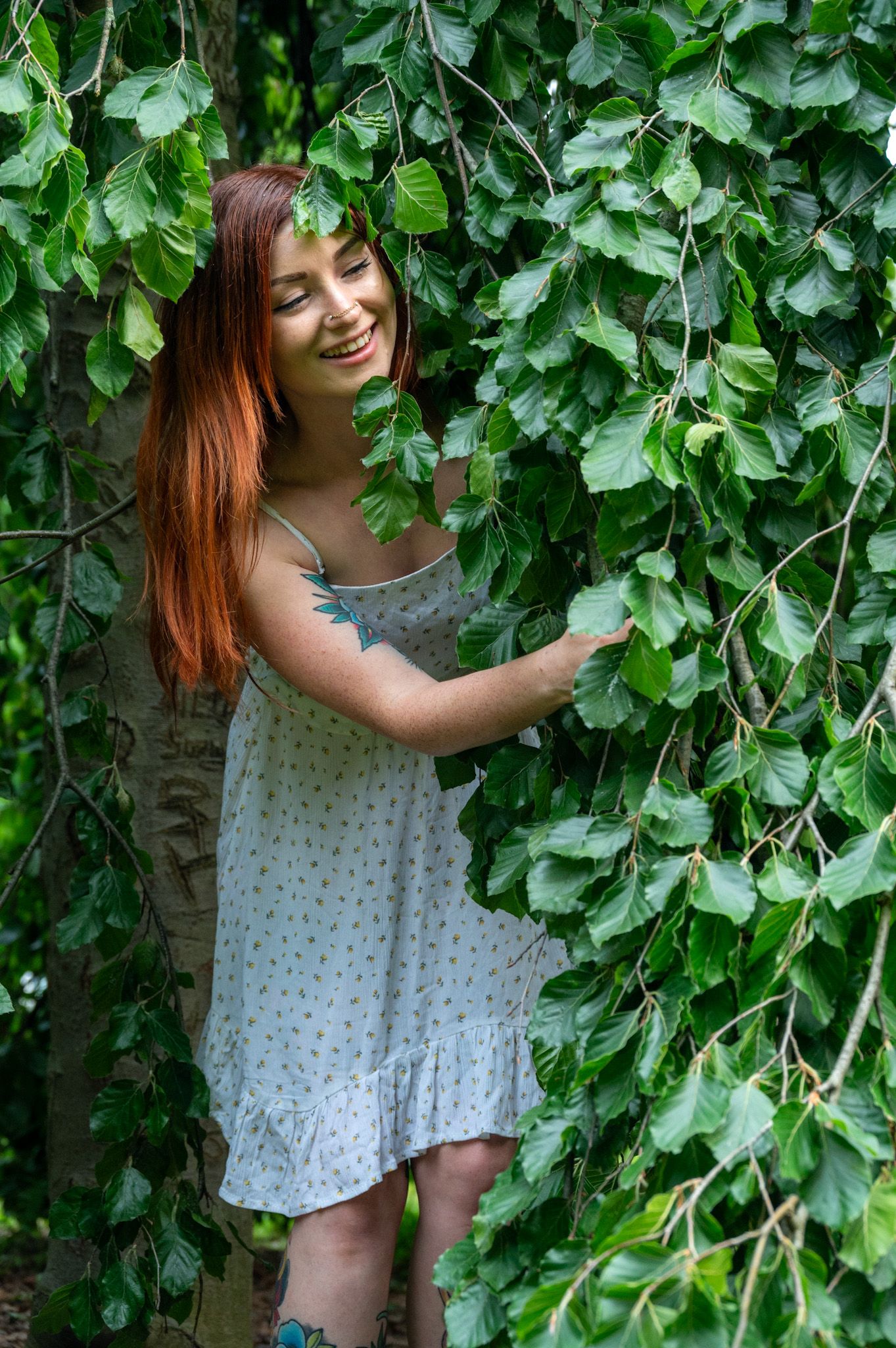 Playful portraits among lush green foliage and leaves.