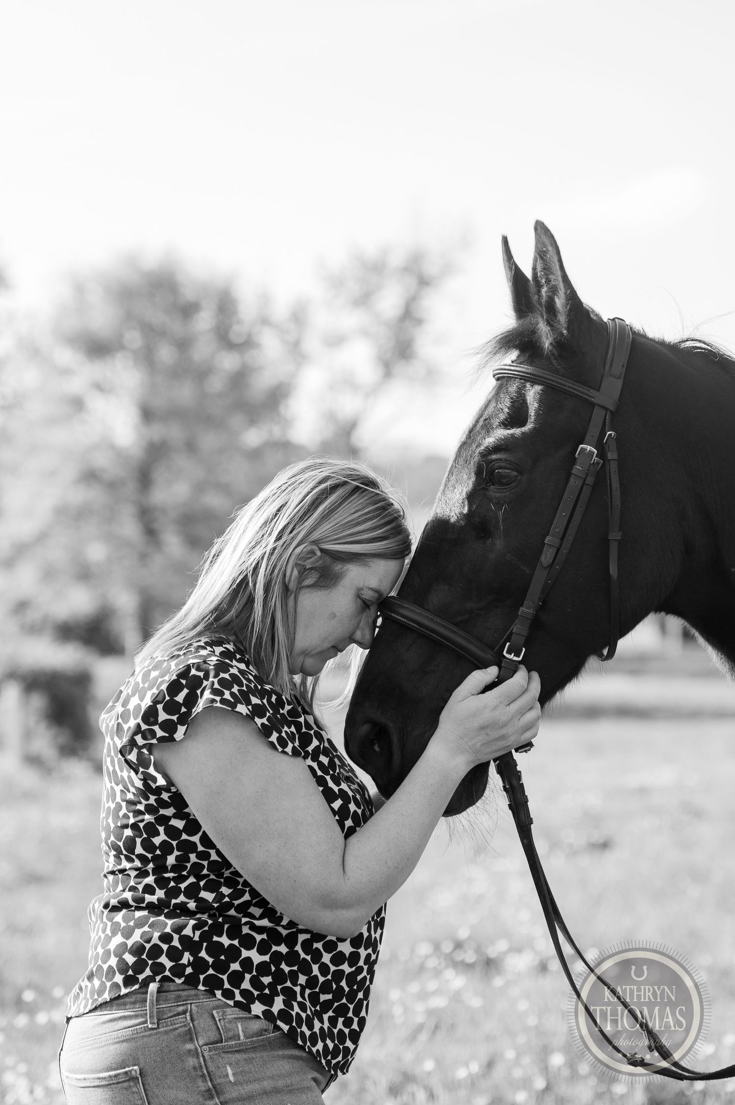 An intimate black and white portrait showing a special bond between horse and human.