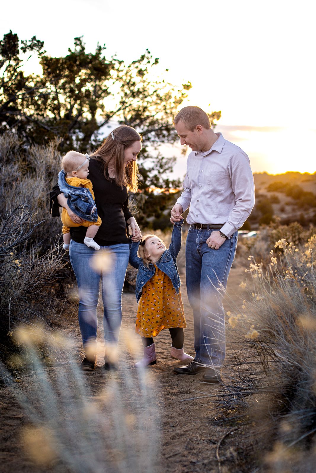 Beautiful outdoor family photography: parents with kids in sunset landscape; Clarissa Anello