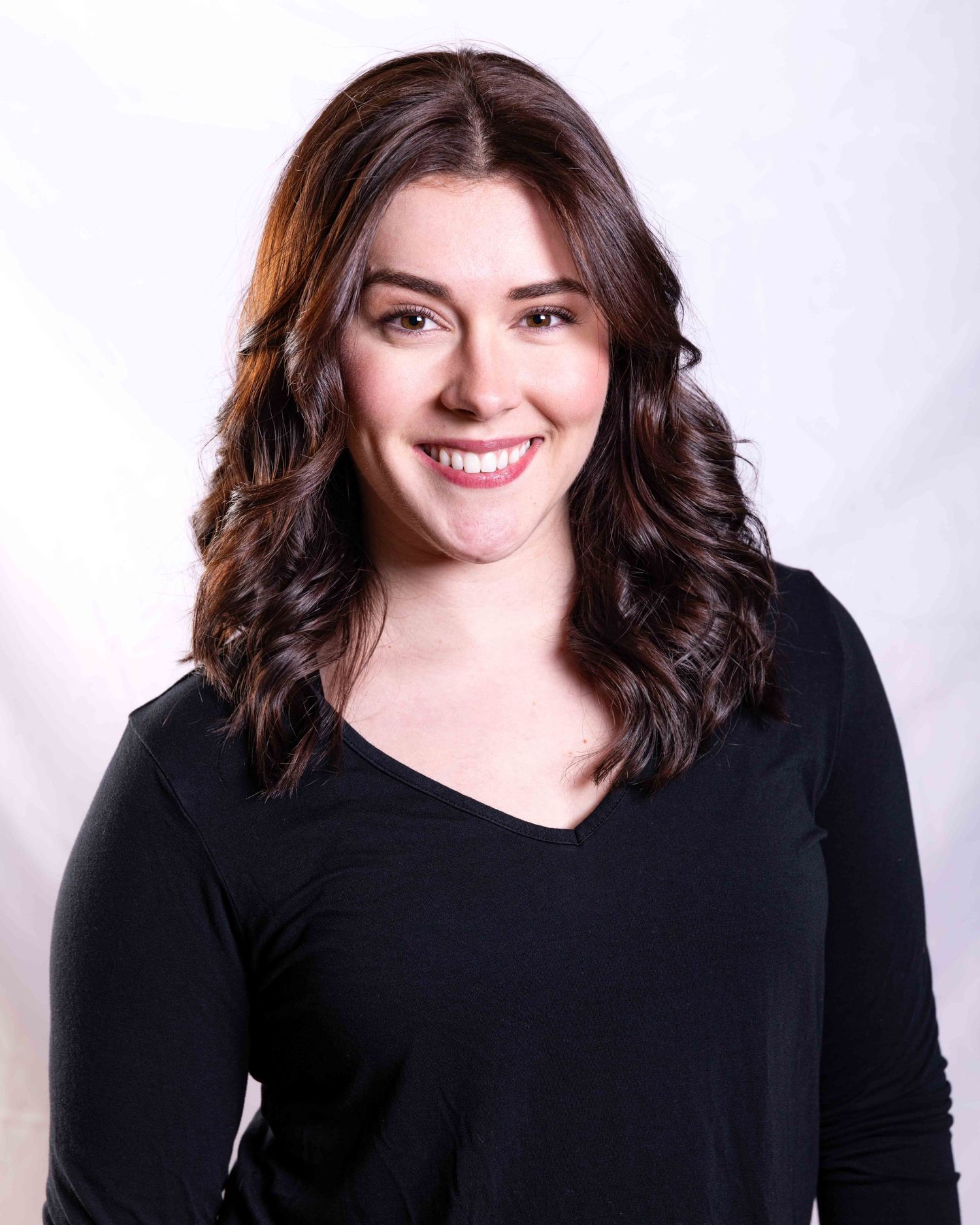 Studio theatre headshot of woman.