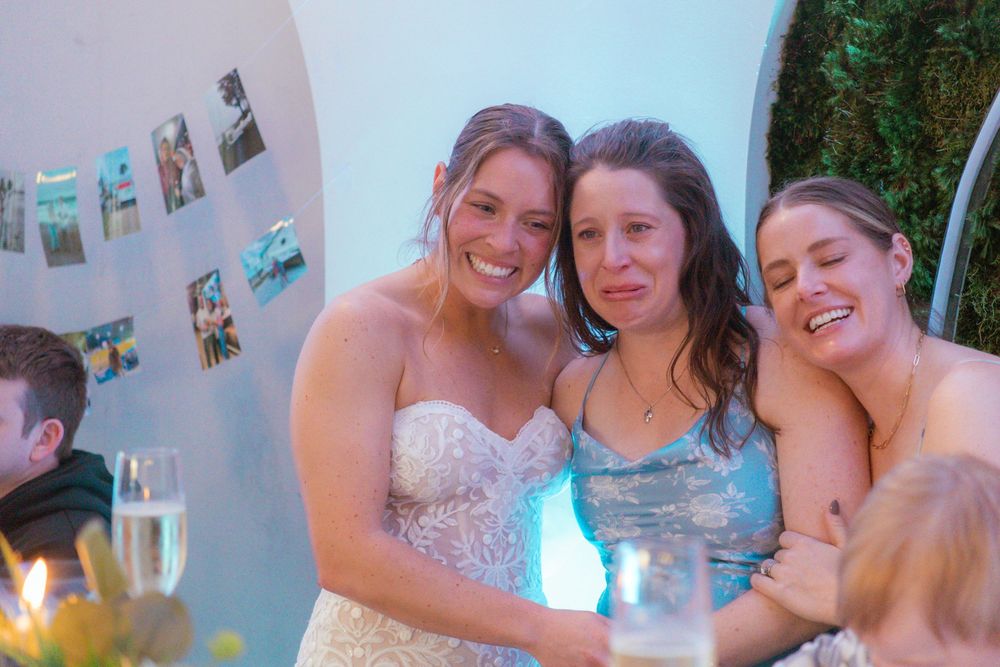 Celebratory moment with bridal party enjoying drinks at the reception.