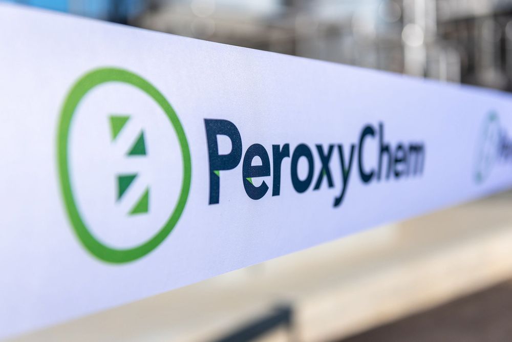 Close-up of PeroxyChem company logo and branding on white surface.
