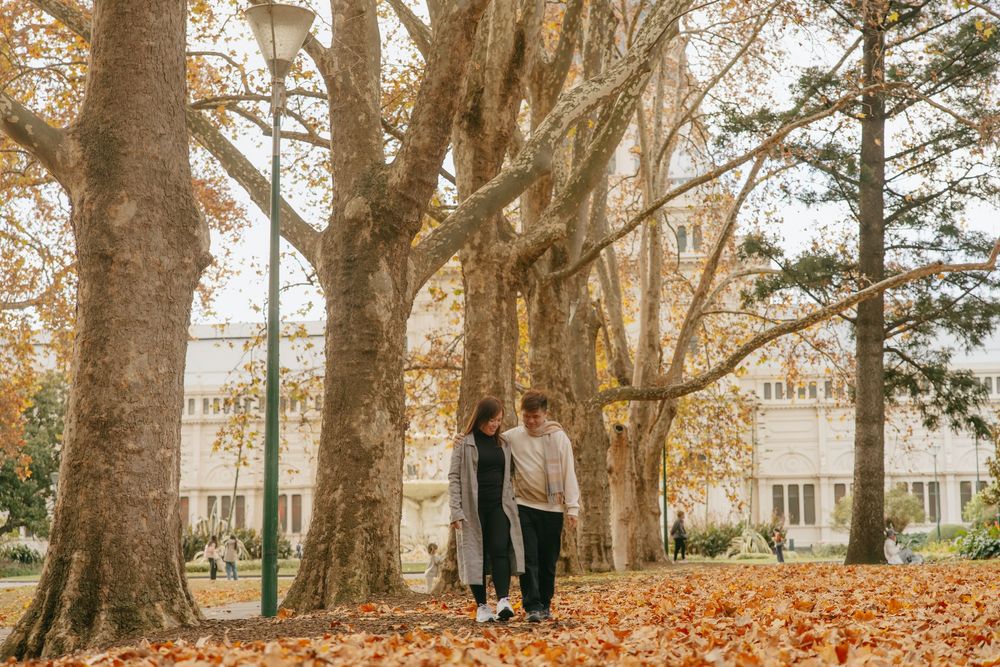 Beautiful fall engagement photos captured in a historic park setting.