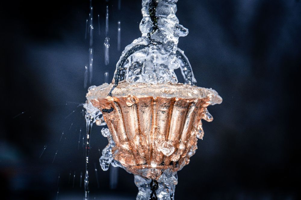 Crystal clear water droplets frozen in motion creating an abstract ice formation.