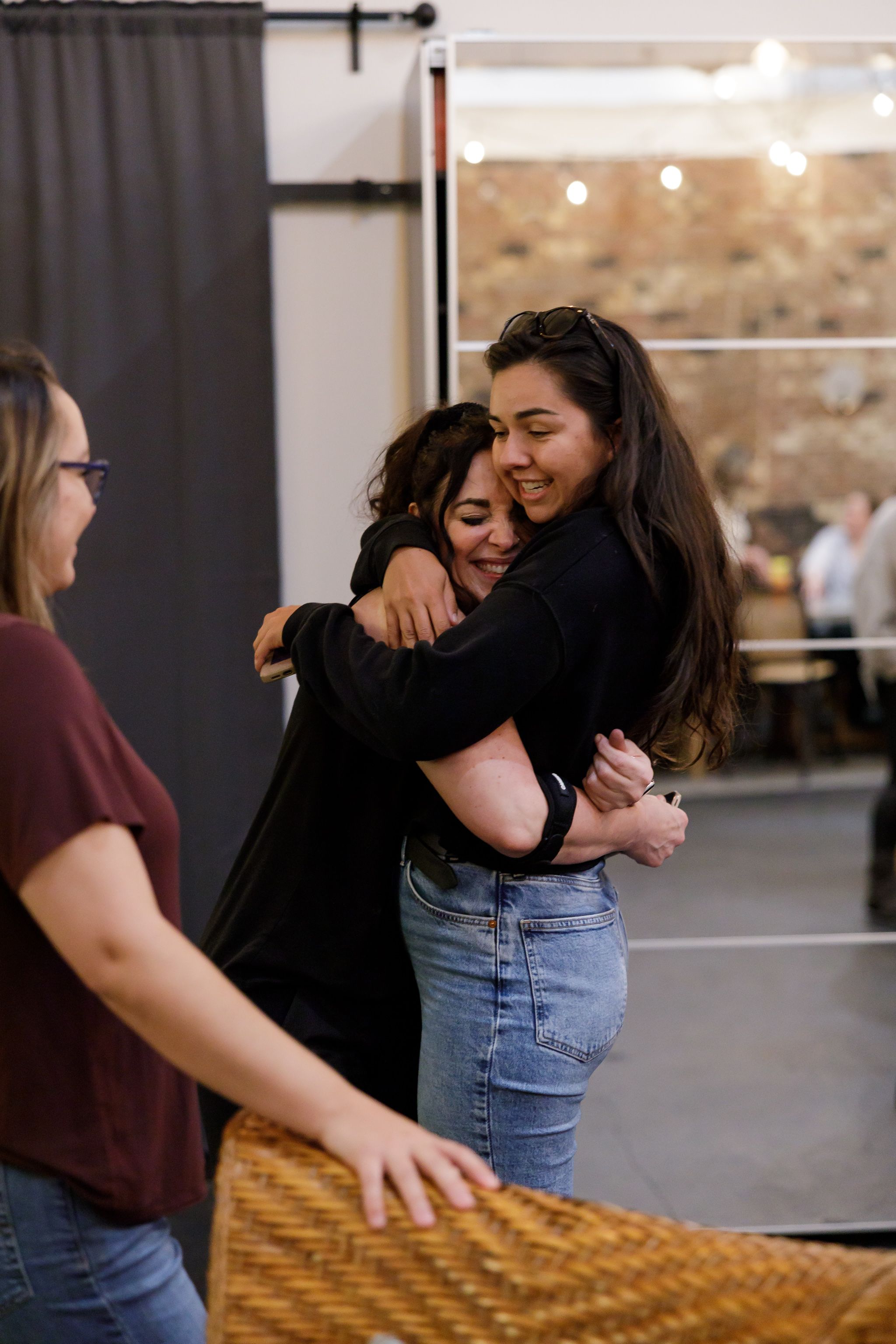 EMPW women's networking community in Puyallup, WA 2 women hugging and connecting at event