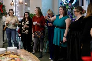 Eastside Entrepreneurs women business owner networking group in Redmond, WA  group of women standing in circle presenting their businesses