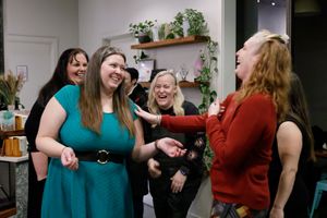 Eastside Entrepreneurs women business owner networking group in Redmond, WA group of women standing together laughing with each other