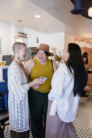 CEO Society women's networking event in Mercer Island, WA women standing laughing connecting together