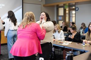 CEO Society women's networking event in Mercer Island, WA women at meeting connecting and gasping together