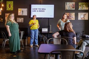 Eastside Entrepreneurs women business owner networking group in Redmond, WA  woman presenting "How to sell like a boss" learning supporting