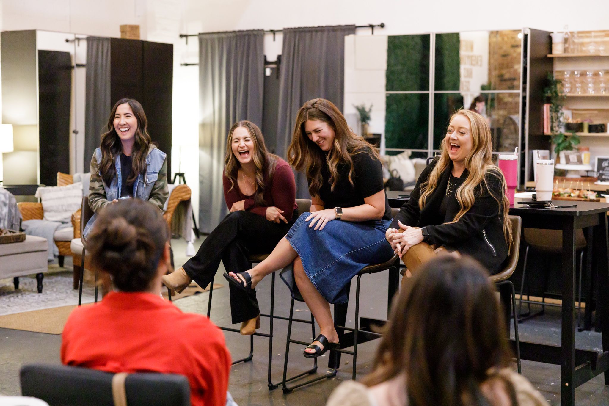 EMPW women's networking community in Puyallup, WA women panel business owners sitting laughing together answering quesitons