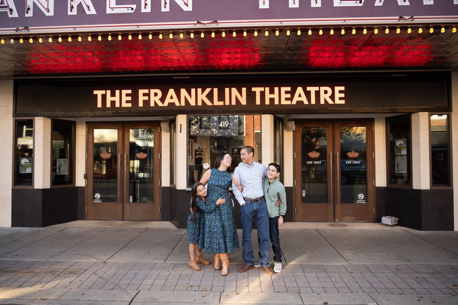 Exterior view of Franklin Theatre marquee sign lit up with Nashville family photographer