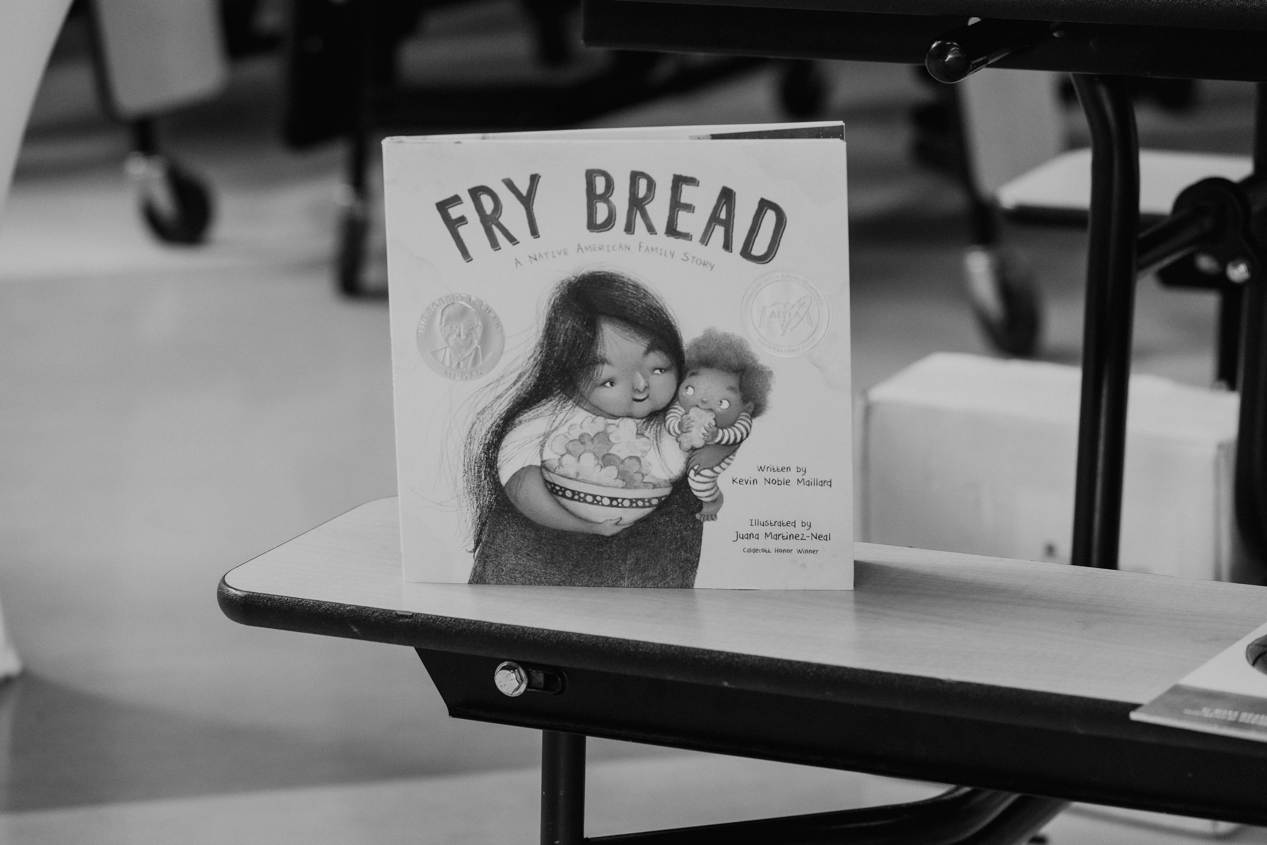Sign reading 'FRY BREAD' displayed in a cafeteria or dining setting.