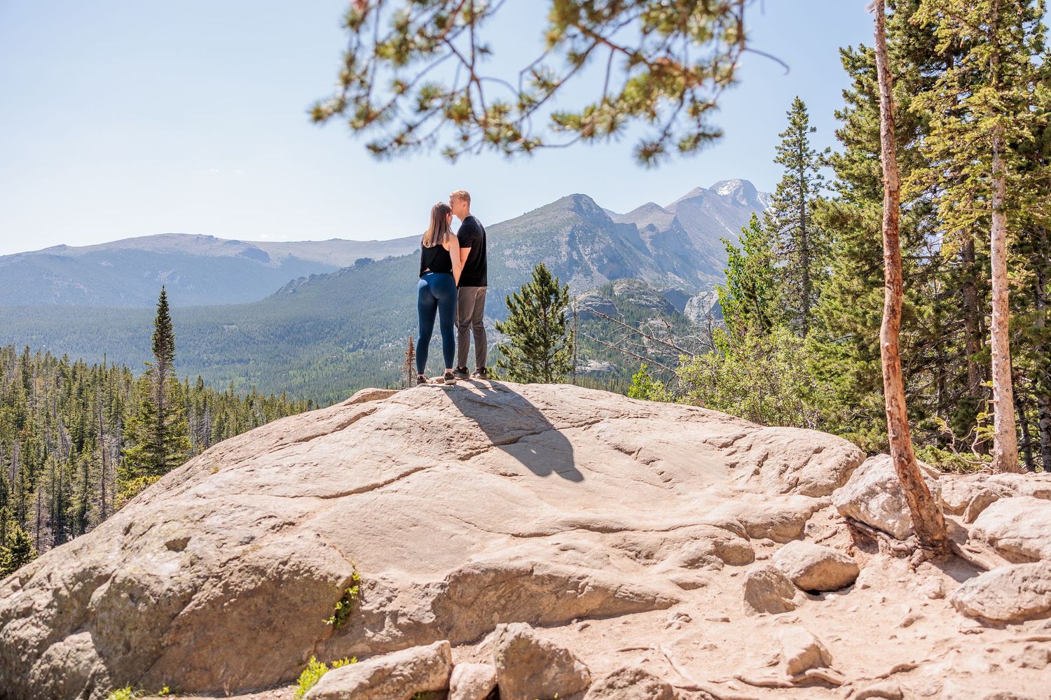 hiking couple eloping at Dream Lake, alpine scenery and glacial lake views, adventurous Rocky Mountain elopement