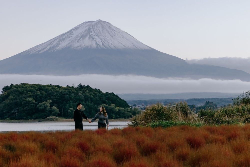Mount Fuji rises majestically above the Japanese landscape in a series of scenic photographs showing different views and seasons.