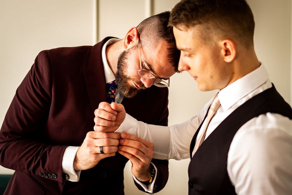 Close-up shots of formal attire preparation with elegant lighting and warm tones.