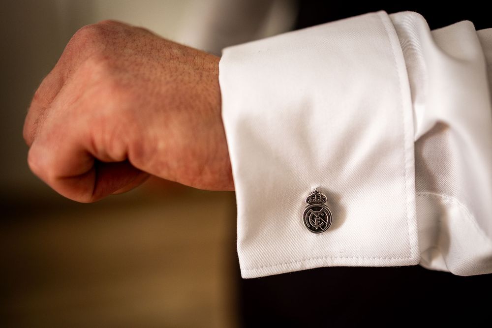 Close-up of formal shirt cuffs with elegant cufflinks.