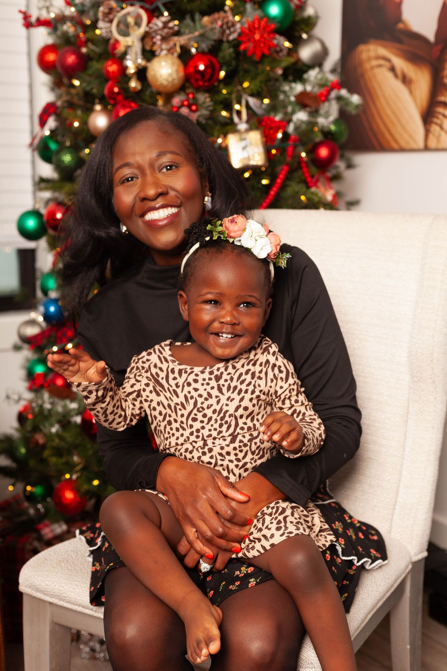 Heartwarming holiday photos show joyful moments in front of a decorated Christmas tree with ornaments and lights.