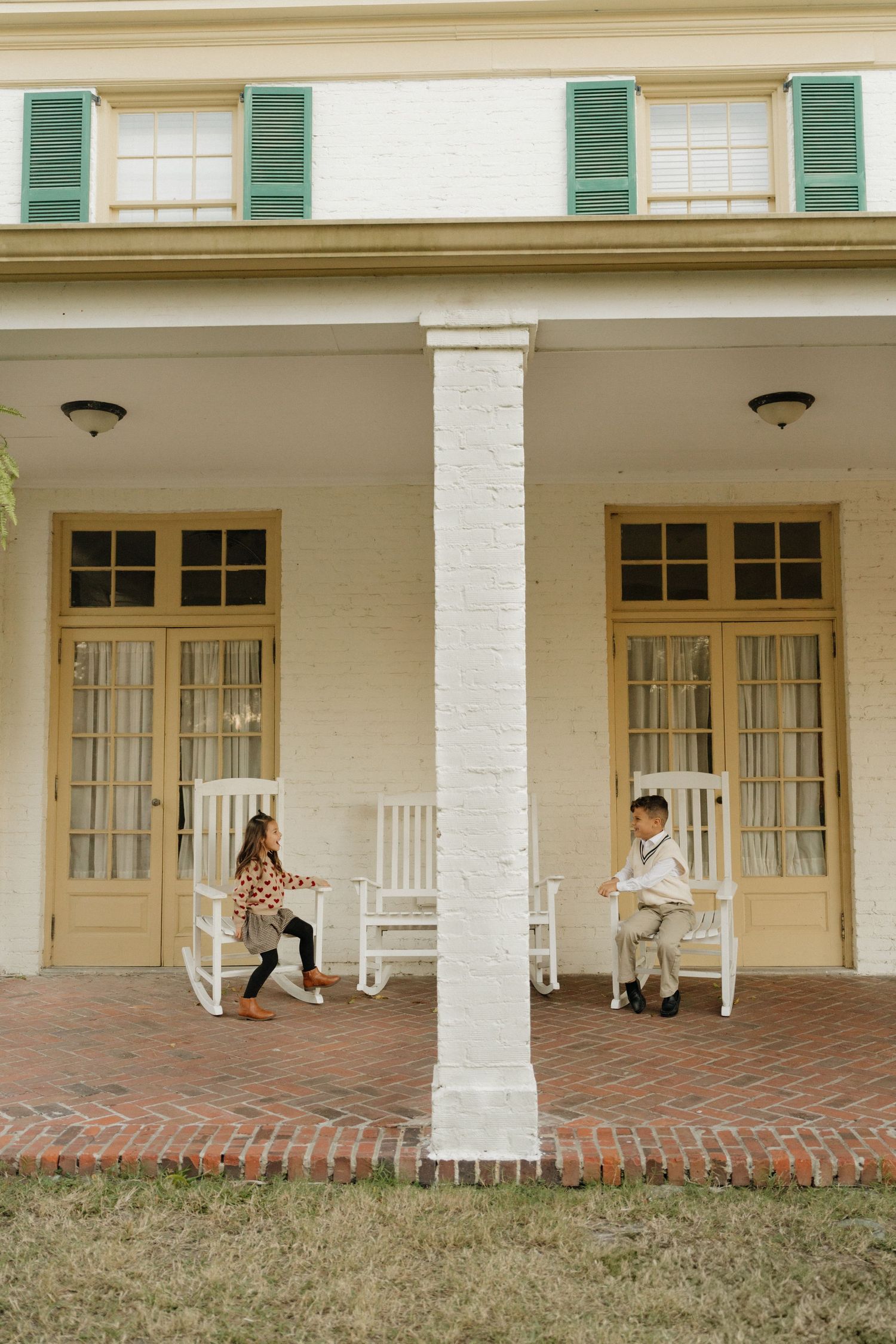 A series of five connected photos showing people sitting and walking on a white-columned porch with green shutters.