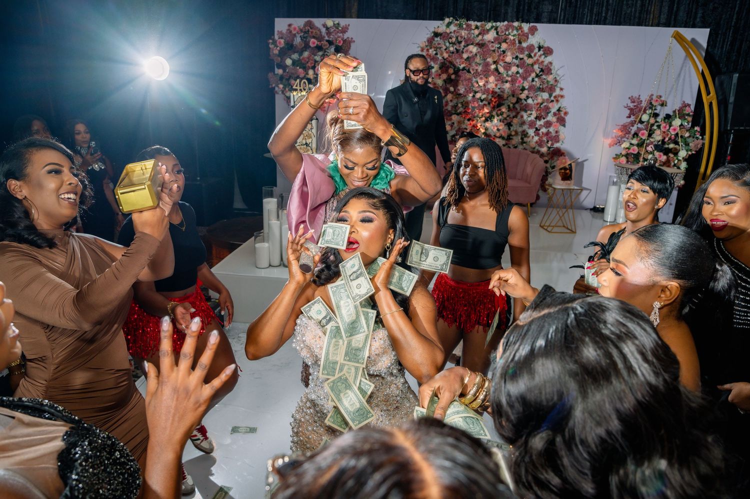 Lively party scene with people dancing and celebrating.