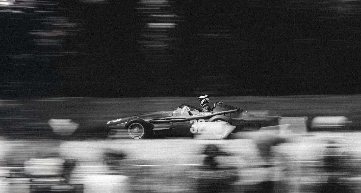 Black and white motion blur of racing action at high speed.