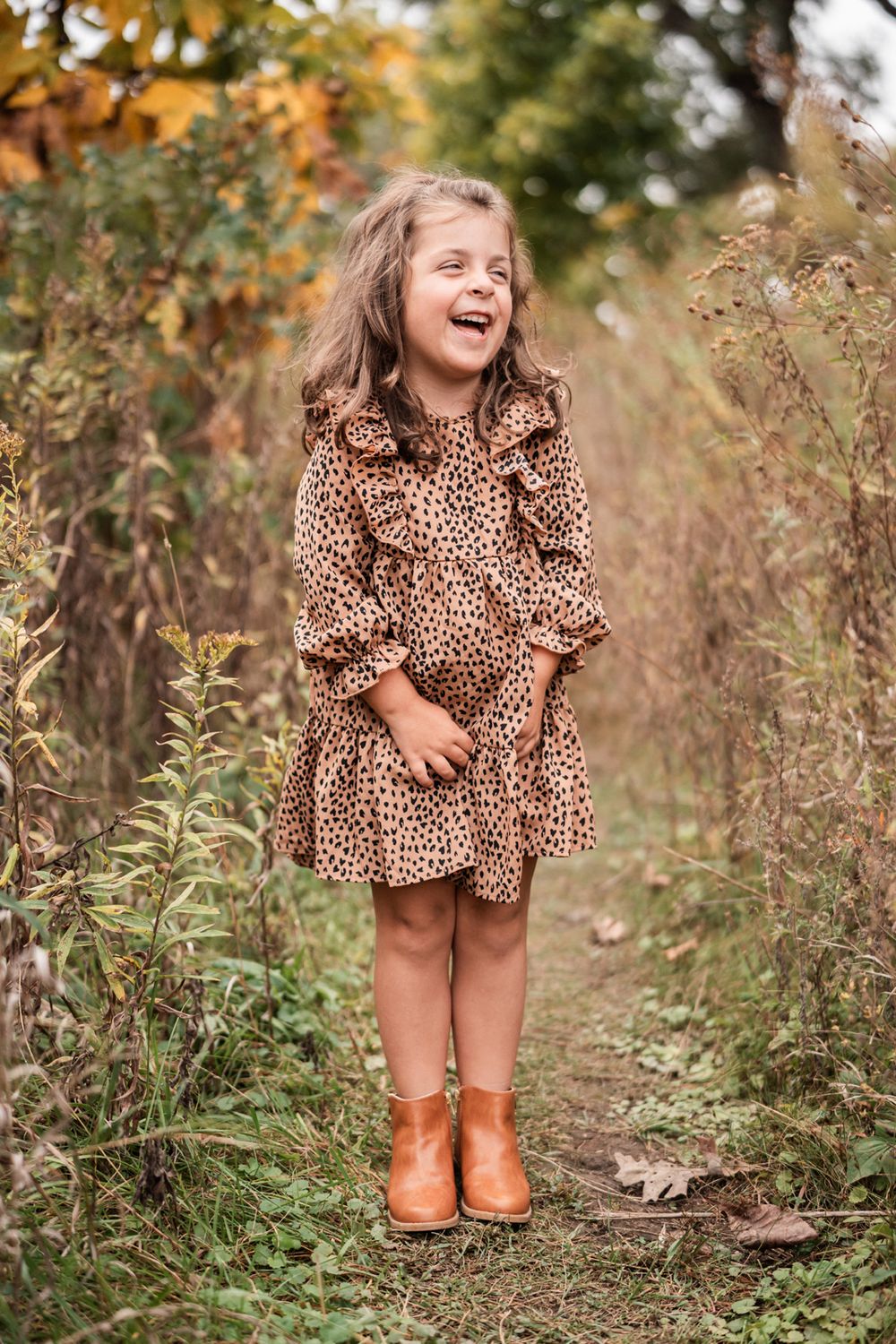 Girl laughing during family portrait session in Oak Brook, Illinois.