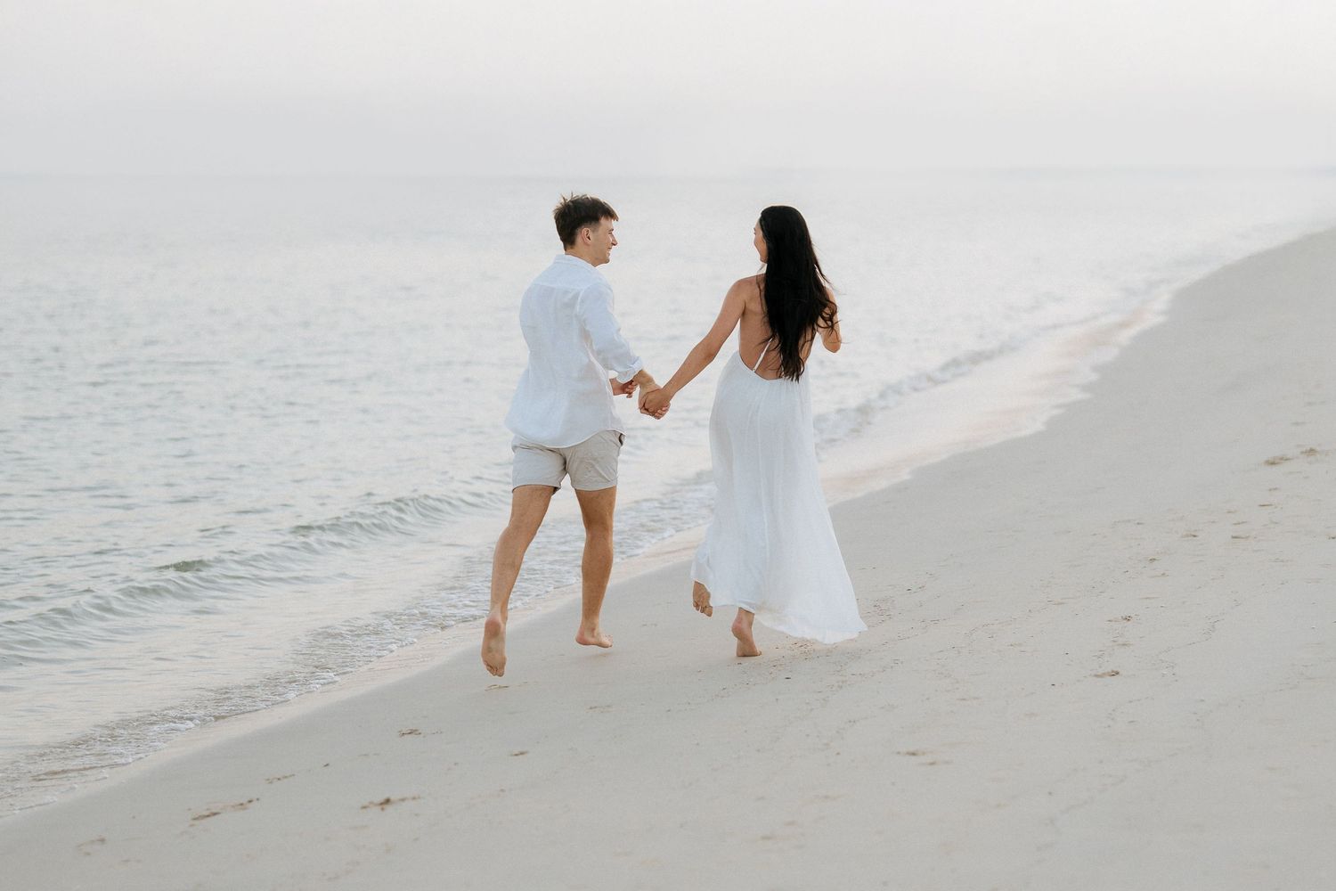 Romantic beach couple photoshoot in Dubai during soft sunset light