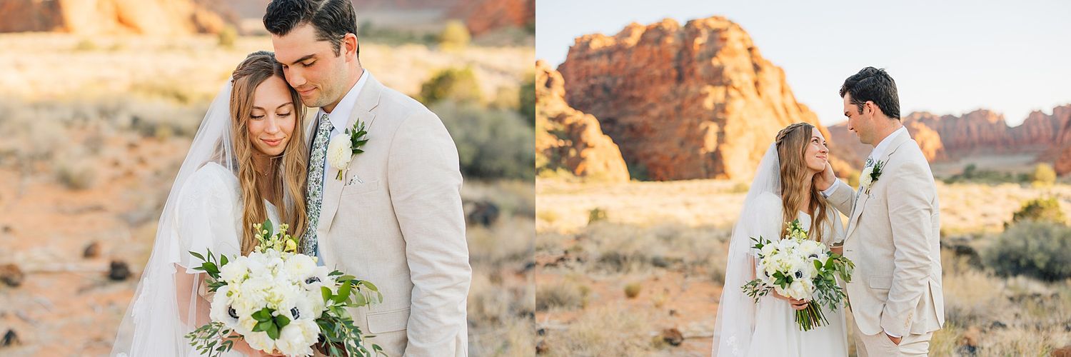 Wedding couple poses in front of stunning red rock formations in a desert setting.