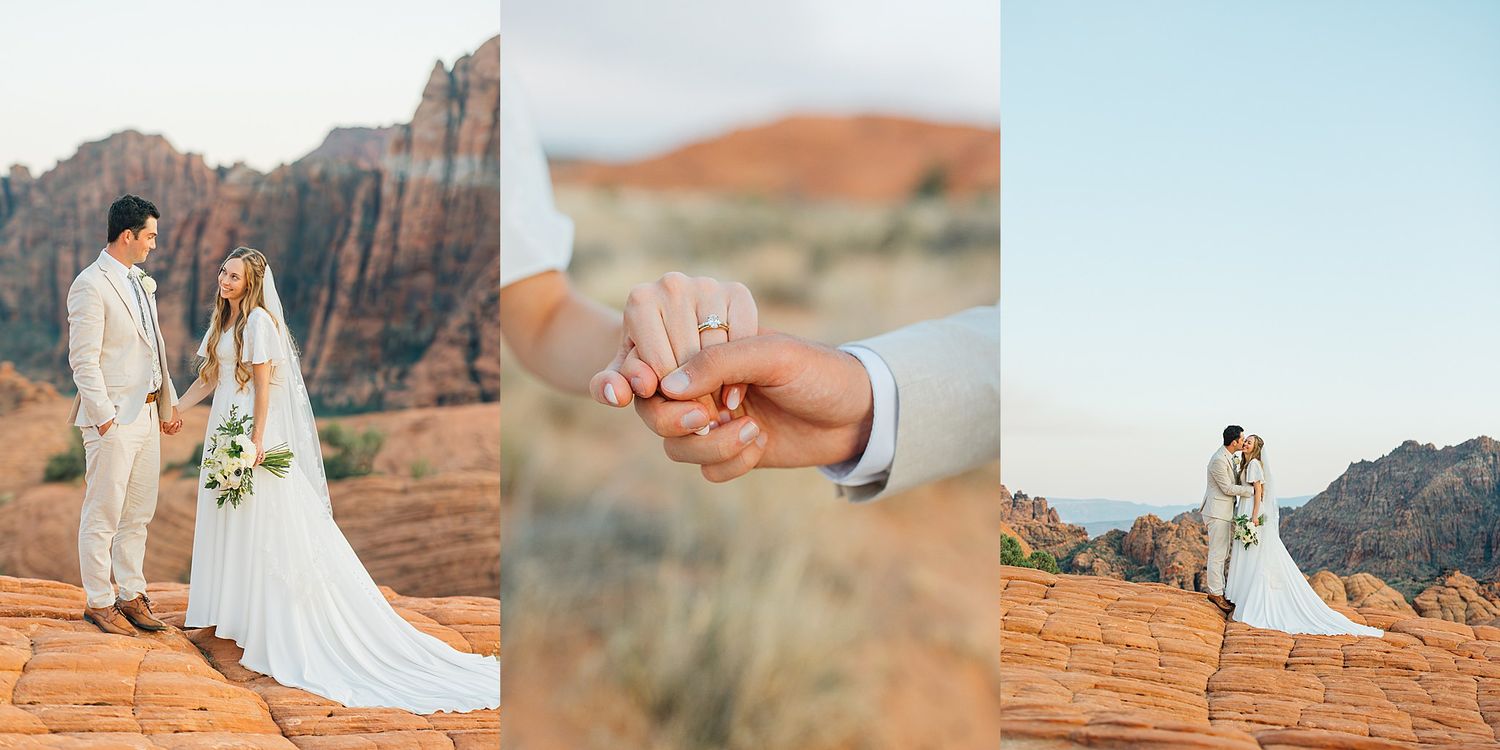 A couple in wedding attire stands together against dramatic red rock formations in a desert landscape at sunset.