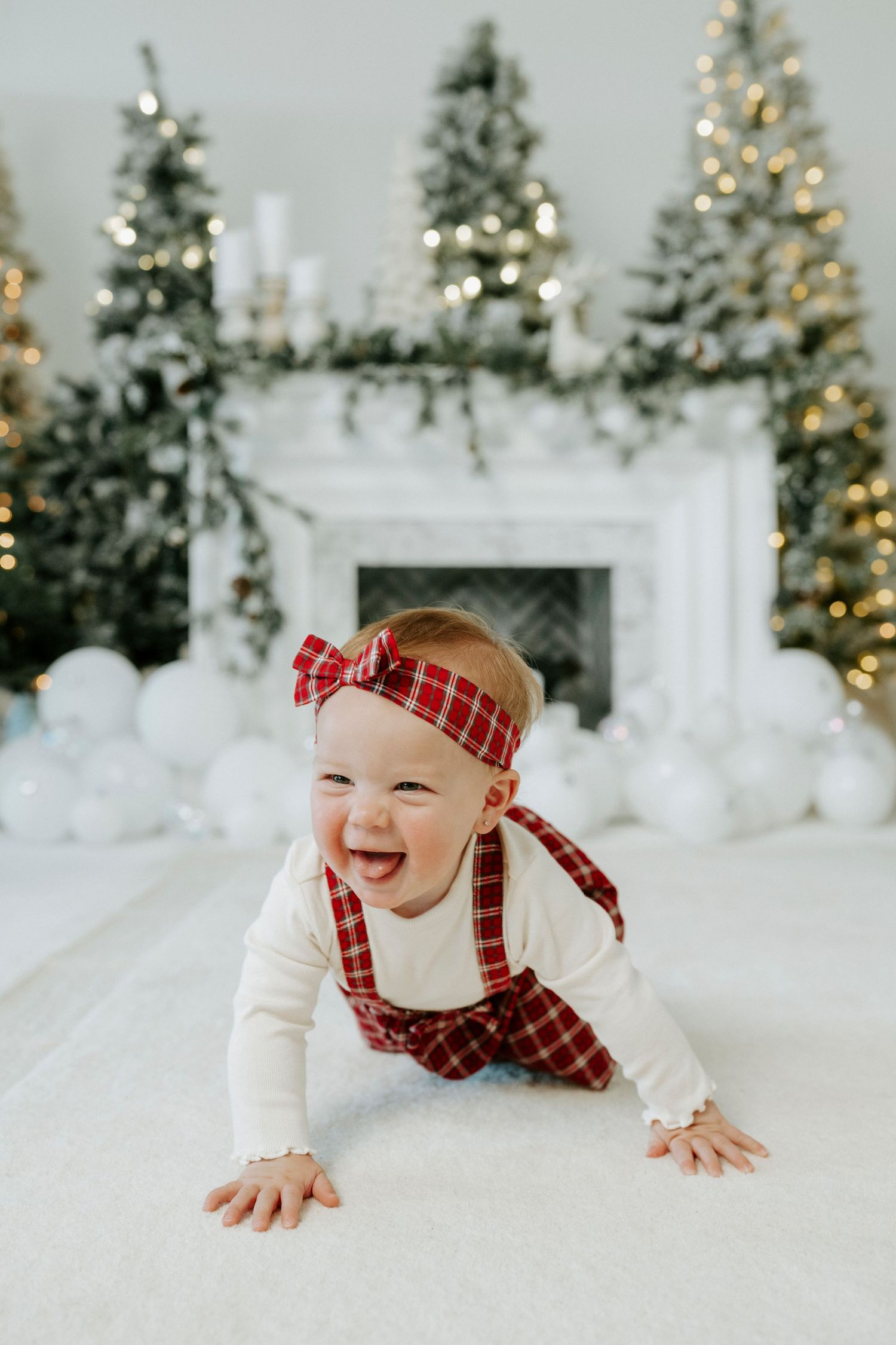 Holiday photo series showing a joyful moment on white backdrop with Christmas trees and twinkling lights in background.