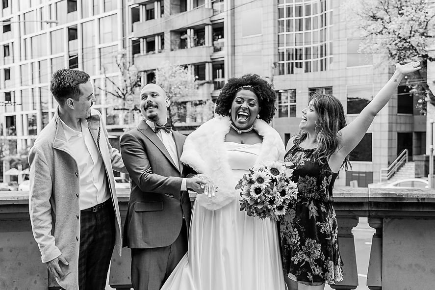 Black and white candid wedding photo series showing joyful moments and laughter during outdoor celebrations.