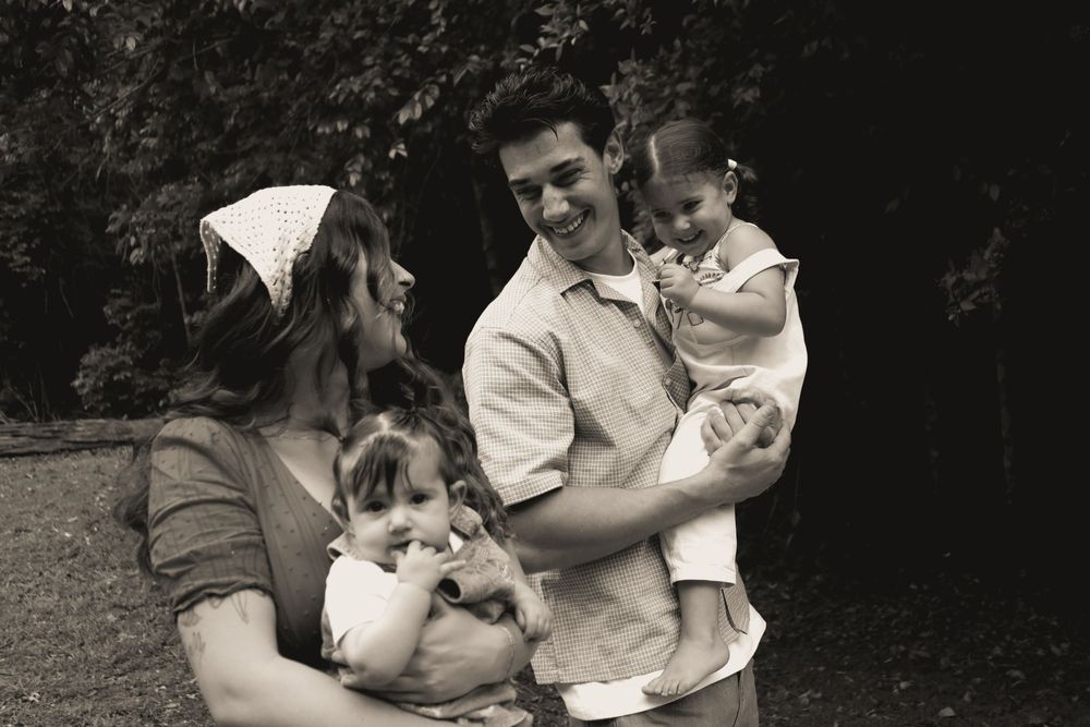 Black and white photo series showing tender moments between parent and child in an outdoor setting.