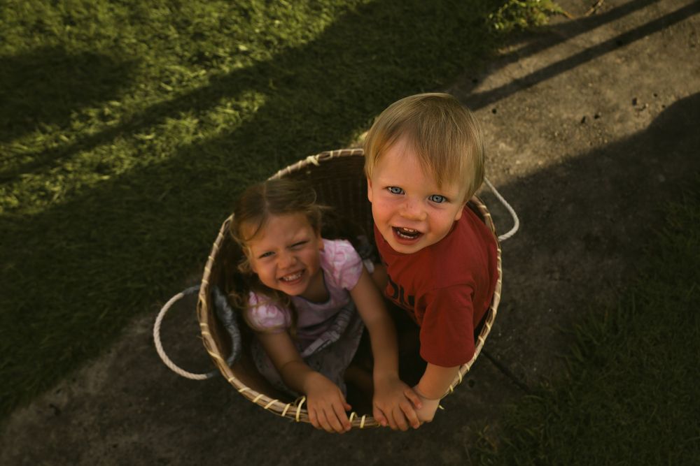 A sequence of candid outdoor photos showing children playing and smiling in natural lighting.
