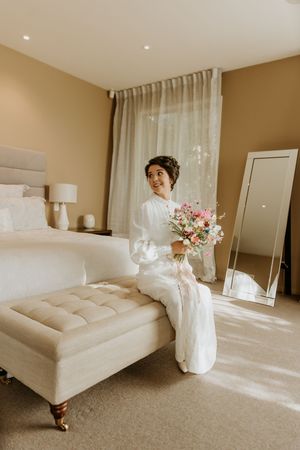 bride sitting in room awaiting wedding to start, professional wedding photographer Christchurch