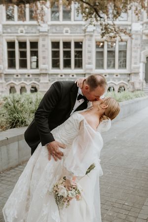 Bride & Groom sharing a kiss after their wedding, Christchurch wedding photographer