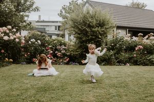 Two young children playing at a wedding, natural light wedding photographer, natural light wedding photographer
