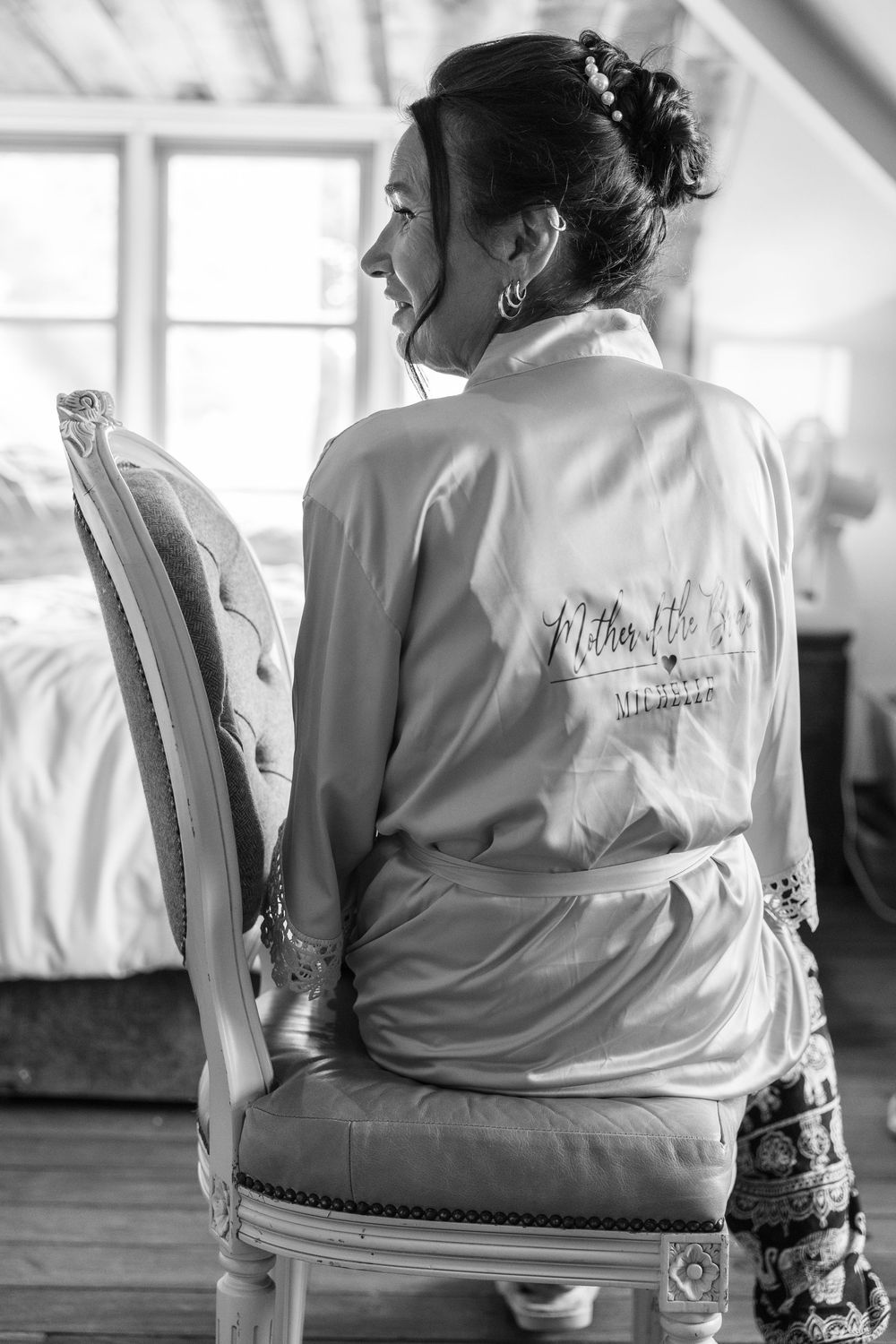 Black and white photo series showing someone seated in a chair wearing a white robe, viewed from behind.