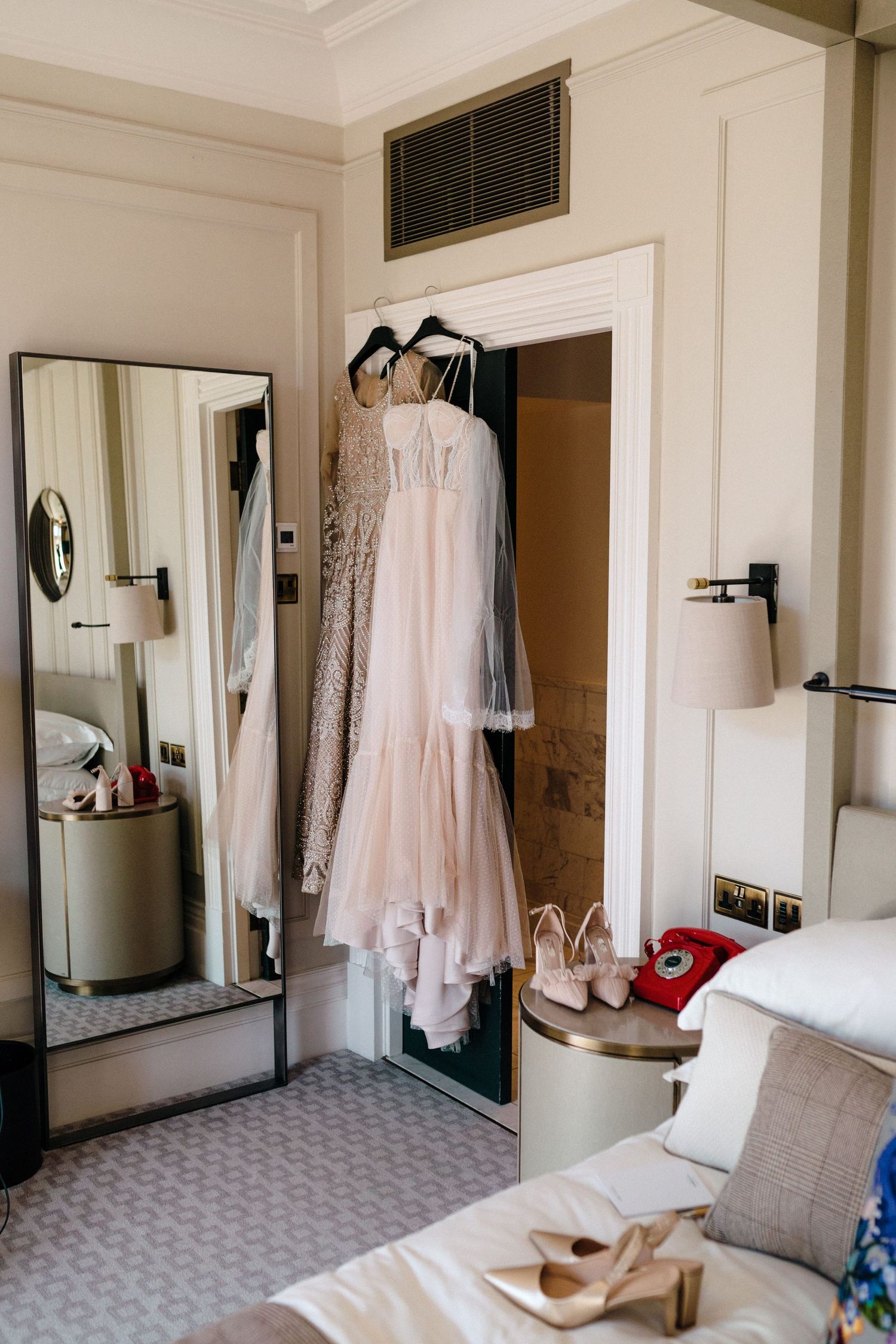 Wedding dresses and accessories displayed in a bridal suite with full-length mirror and neutral decor at The Lord Nelson, Halifax
