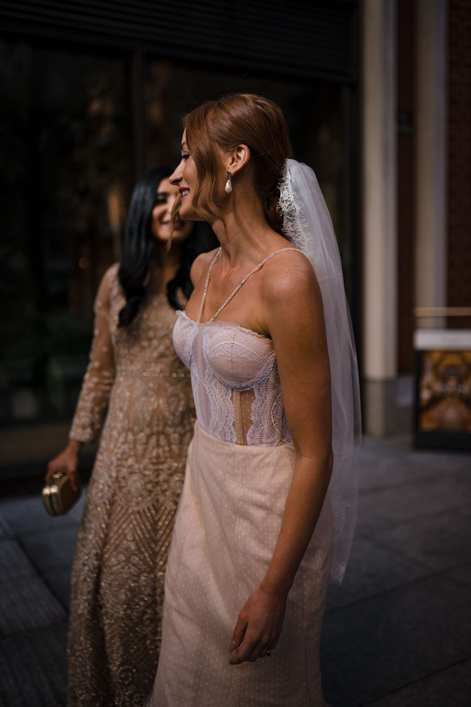 Bridal portrait showing detailed lace corset wedding dress and flowing veil near The Lord Nelson, Halifax for photographer
