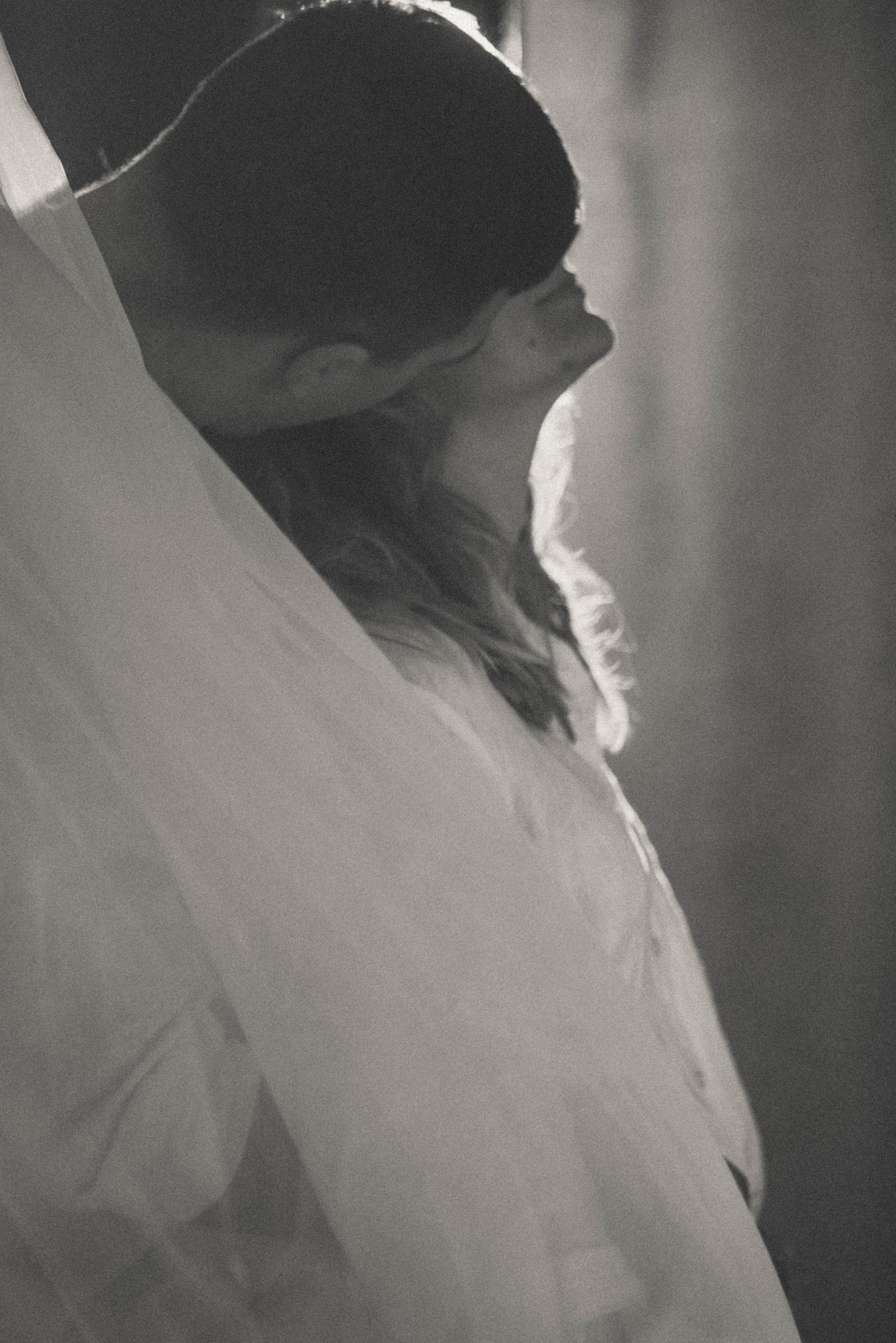 Artistic black and white profile silhouettes in sequence.