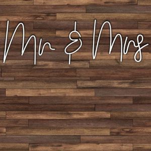 Celebrate in style with a 'Mr. & Mrs.' neon sign prop for your photo booth, adding a romantic and glowing touch to your special day!