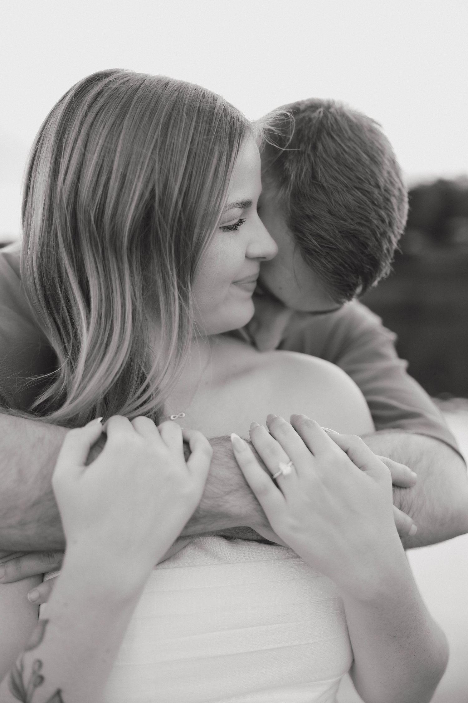 Intimate black and white close-up portraits capturing tender romantic moments between a couple.