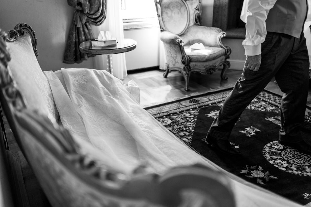 A black and white photo series showing a bride and groom's preparation and celebration moments on their wedding day.